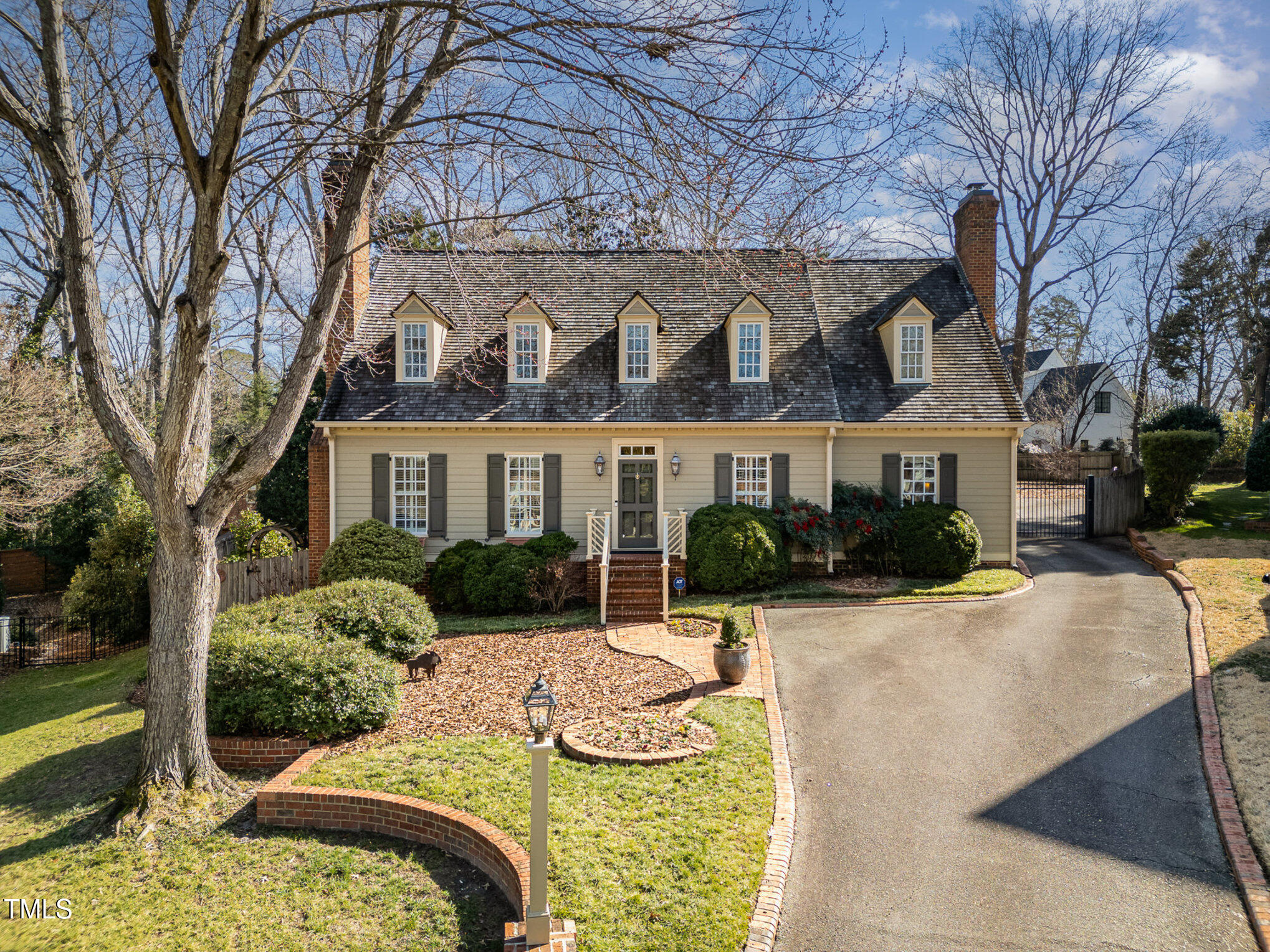 1420 Dogwood Lane Raleigh, NC 27607 - Photo 2 of 37 a view of a house with a yard covered in snow