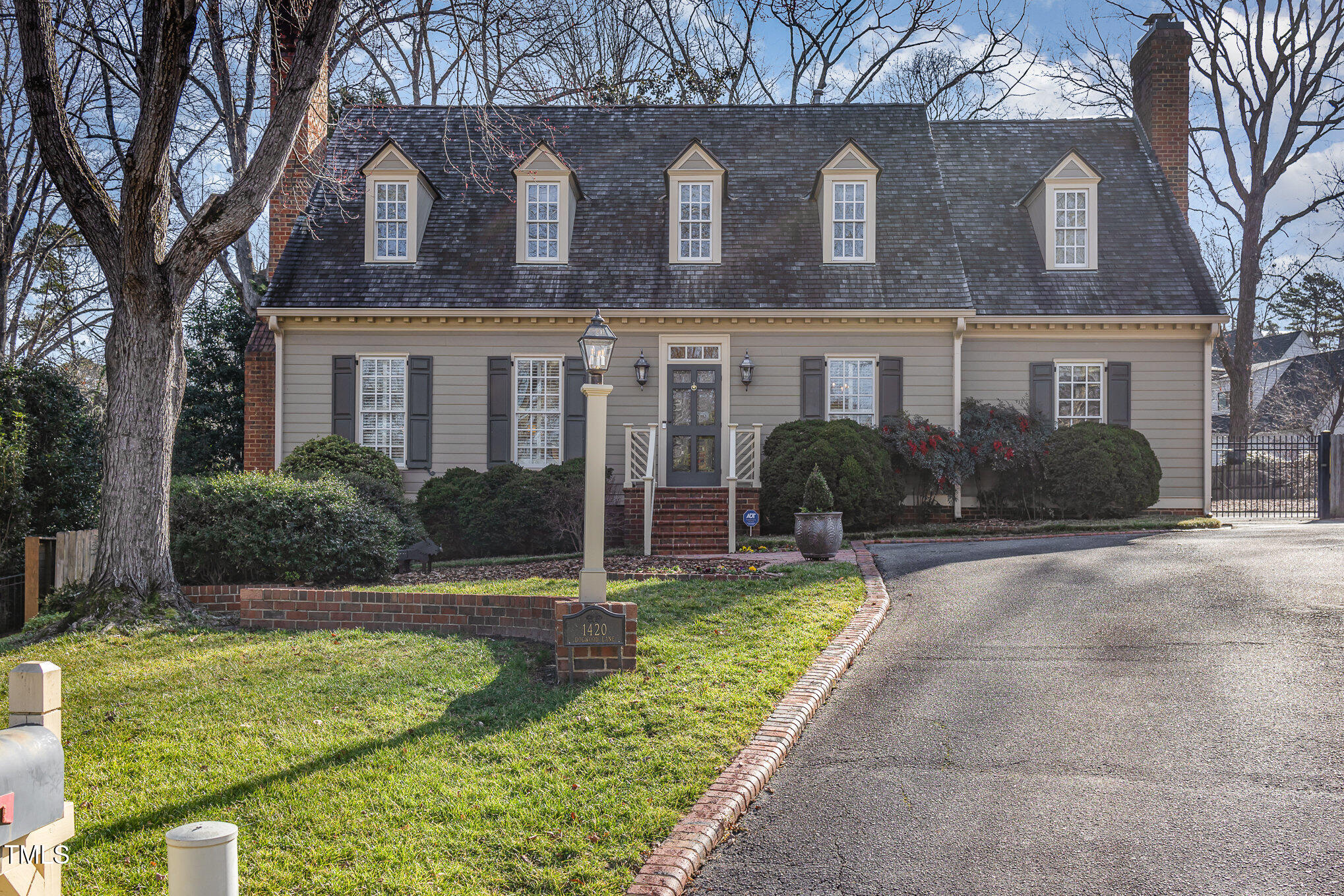 1420 Dogwood Lane Raleigh, NC 27607 - Photo 3 of 37 a front view of a house with garden and a tree