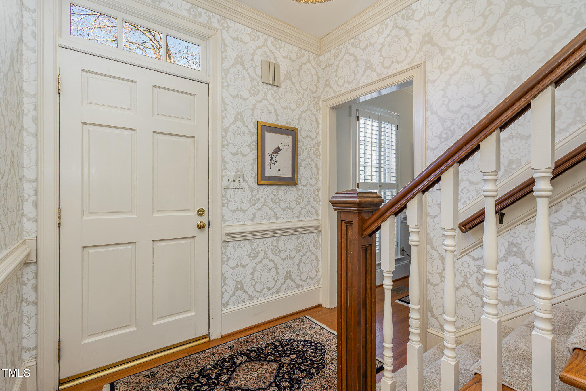 1420 Dogwood Lane Raleigh, NC 27607 - Photo 6 of 37 a view of entryway with wooden floor and stairs