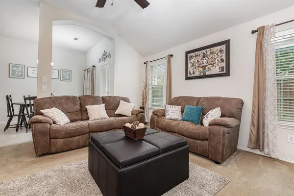 a living room with furniture and a couch
