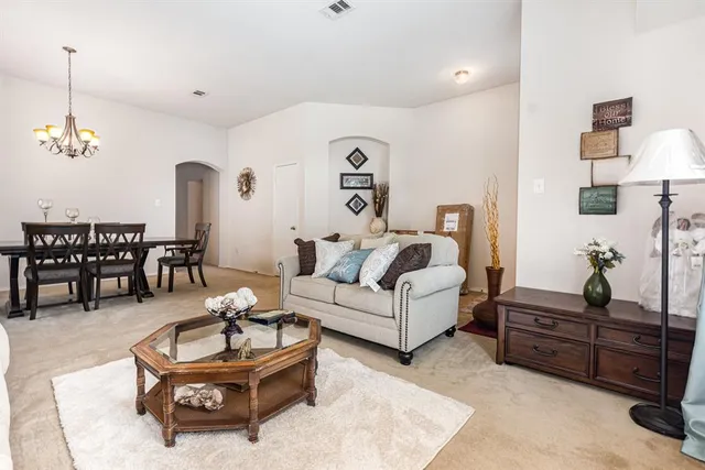 a living room with furniture and a table