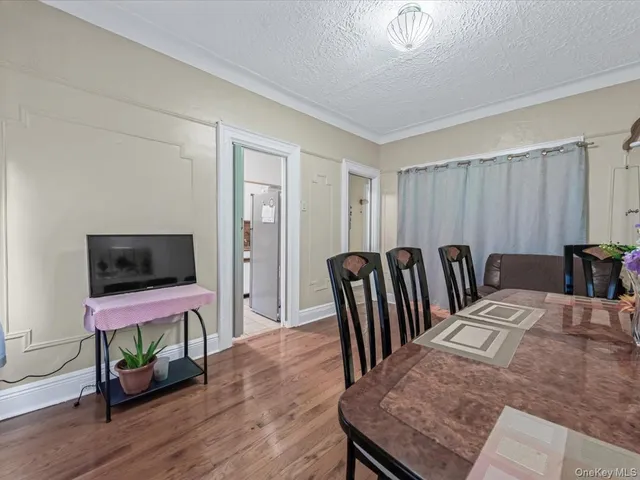 a view of a livingroom with furniture and a flat screen tv