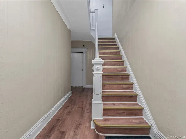 a view of entryway with wooden floor