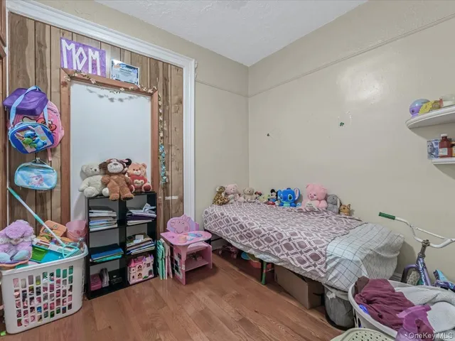 a bedroom with a bed and cabinets