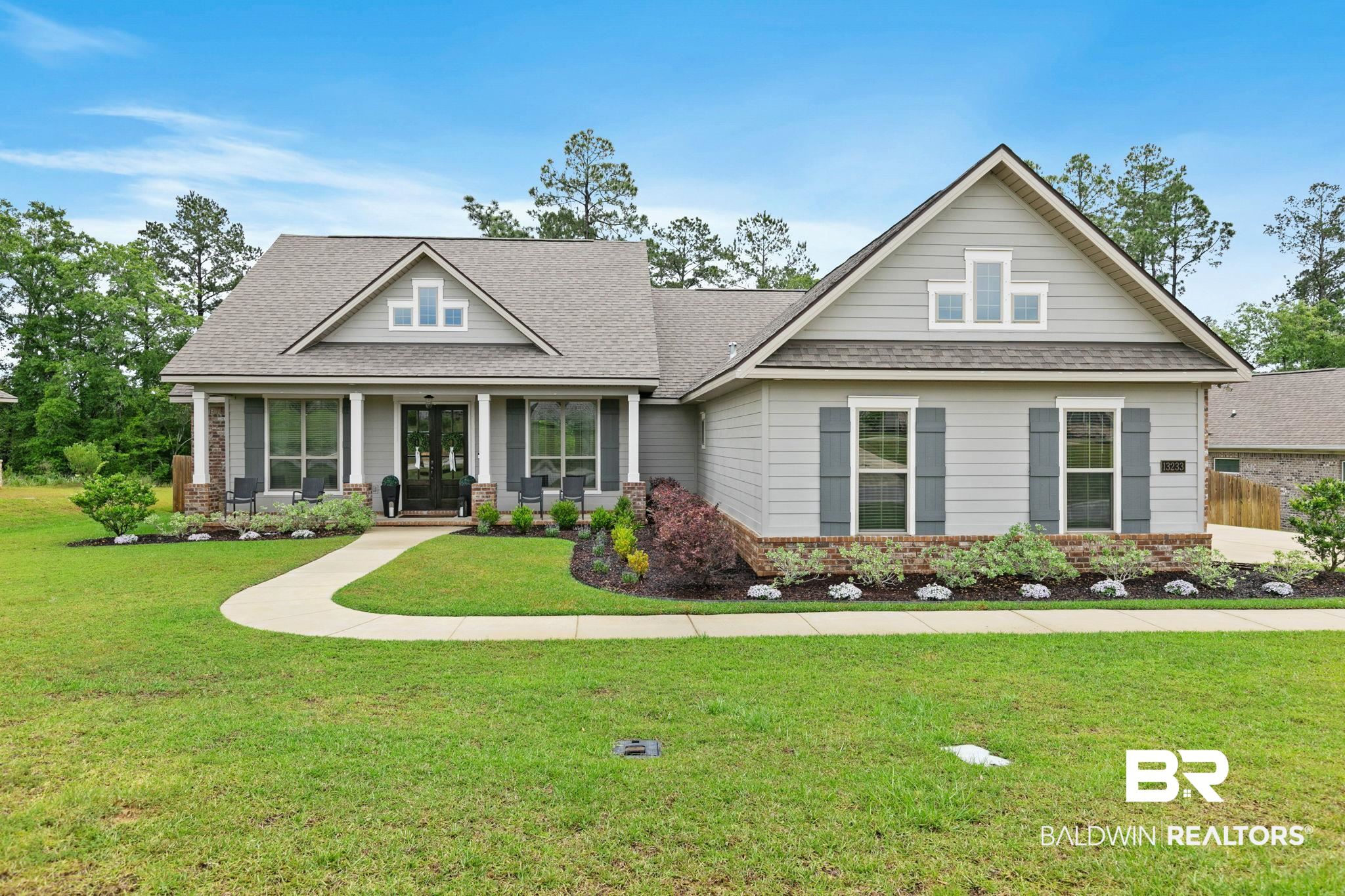 13233 Ibis Boulevard Daphne, AL 36527 - Photo 66 of 100 Expansive front lawn with a curved paved walkway