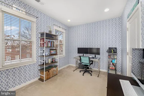 a workspace with furniture and window