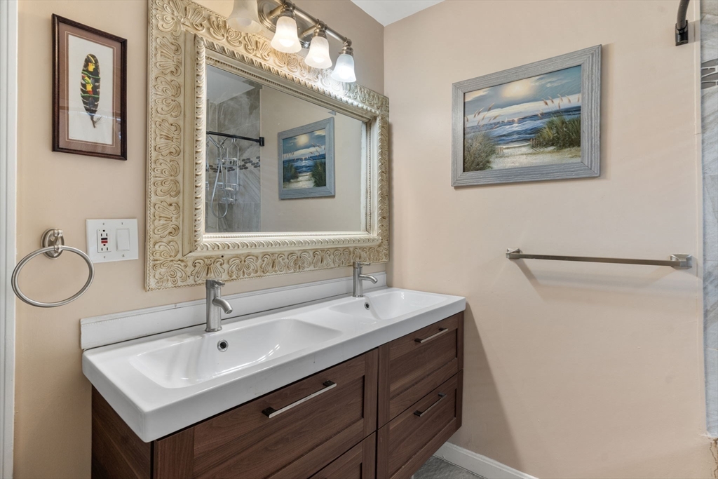 9 Marshall Street Winthrop, MA 02152 - Photo 14 of 34 a bathroom with a double vanity sink mirror and toilet