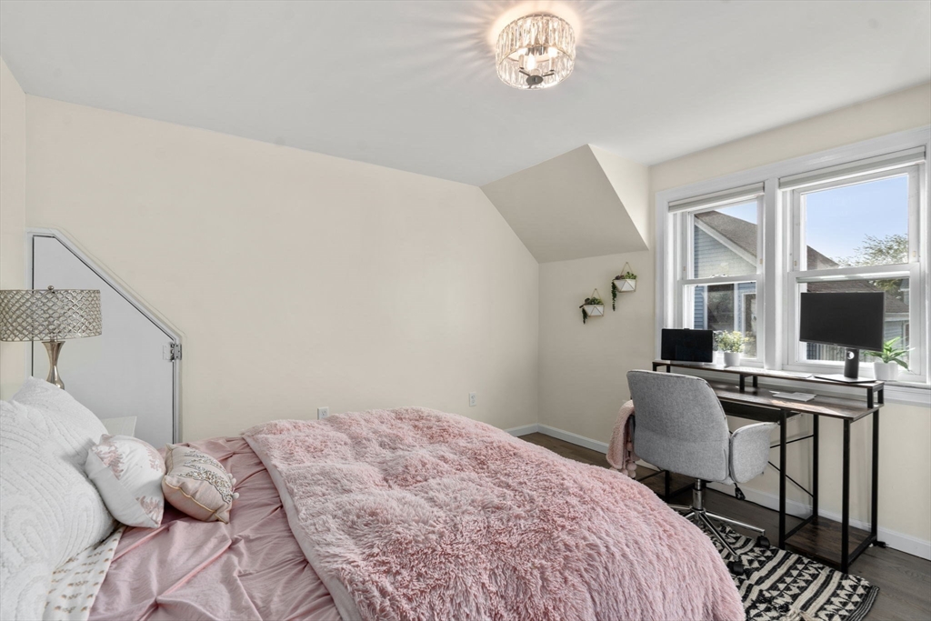 9 Marshall Street Winthrop, MA 02152 - Photo 16 of 34 a bedroom with a bed and a flat screen tv