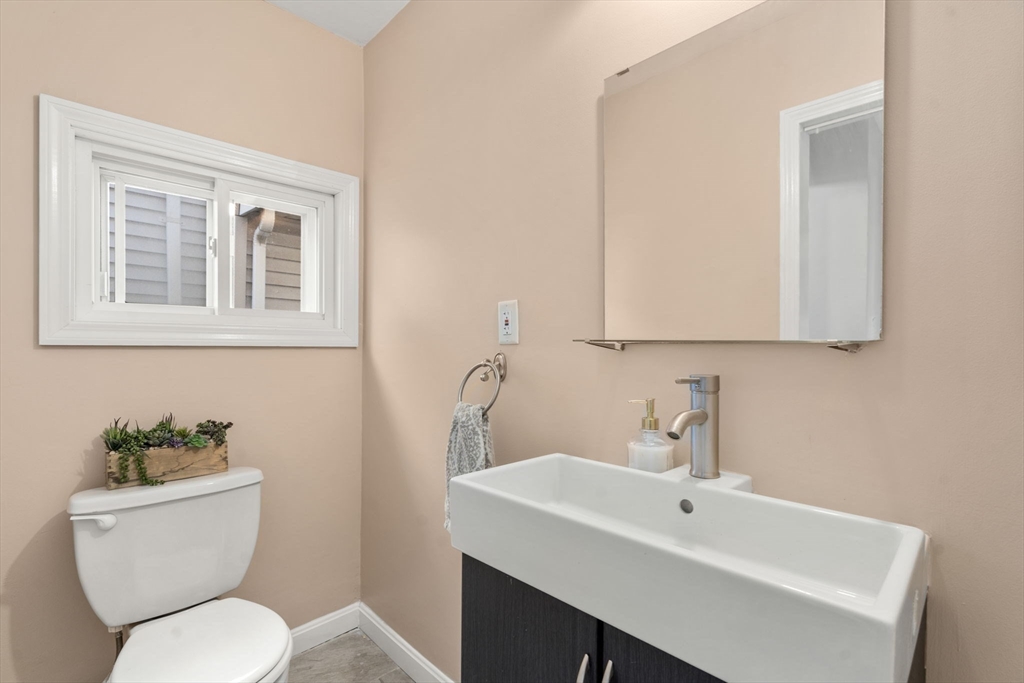 9 Marshall Street Winthrop, MA 02152 - Photo 17 of 34 a bathroom with a toilet a sink and a mirror