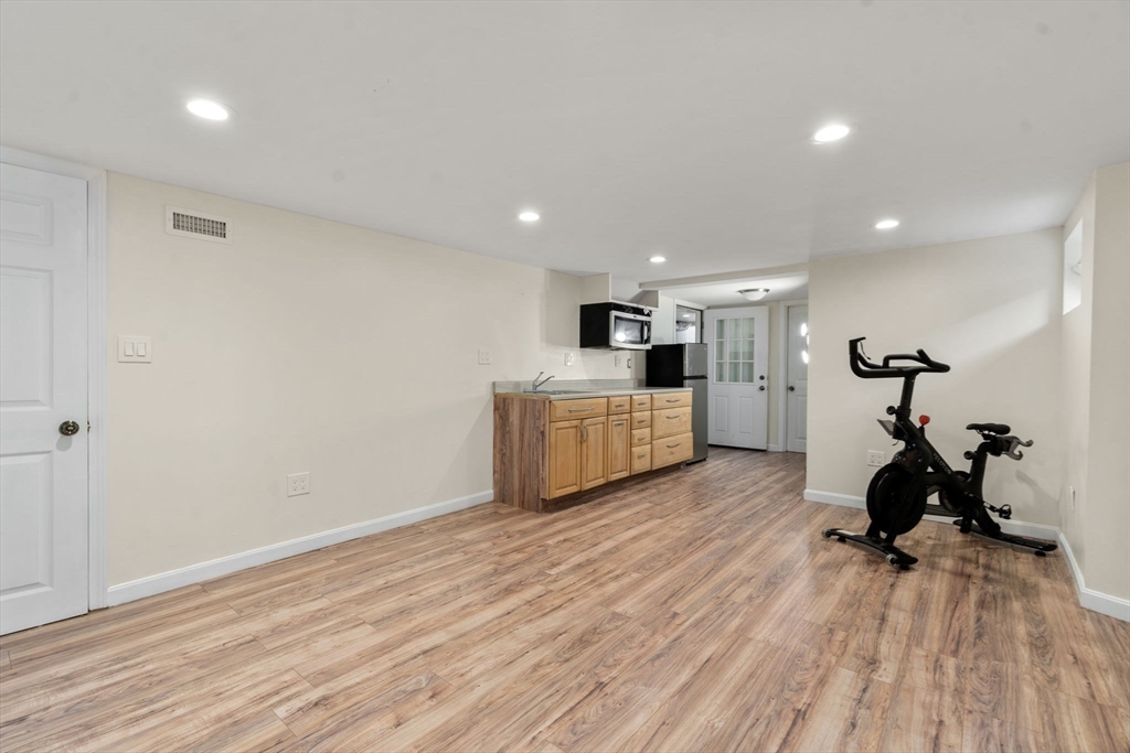 9 Marshall Street Winthrop, MA 02152 - Photo 19 of 34 a view of a room with wooden floor and furniture