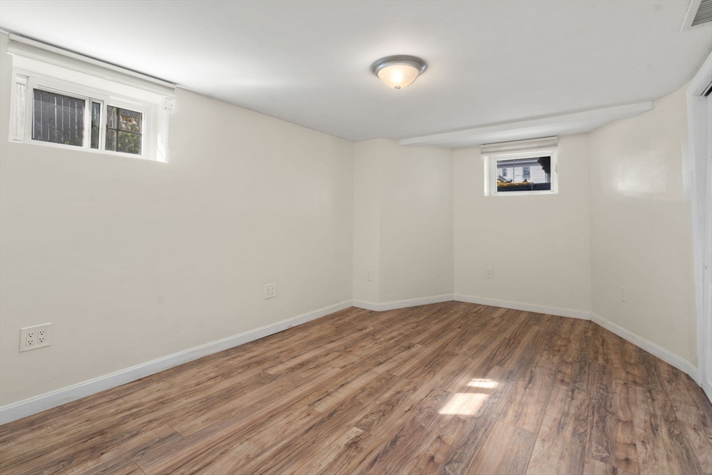9 Marshall Street Winthrop, MA 02152 - Photo 20 of 34 a view of empty room with wooden floor