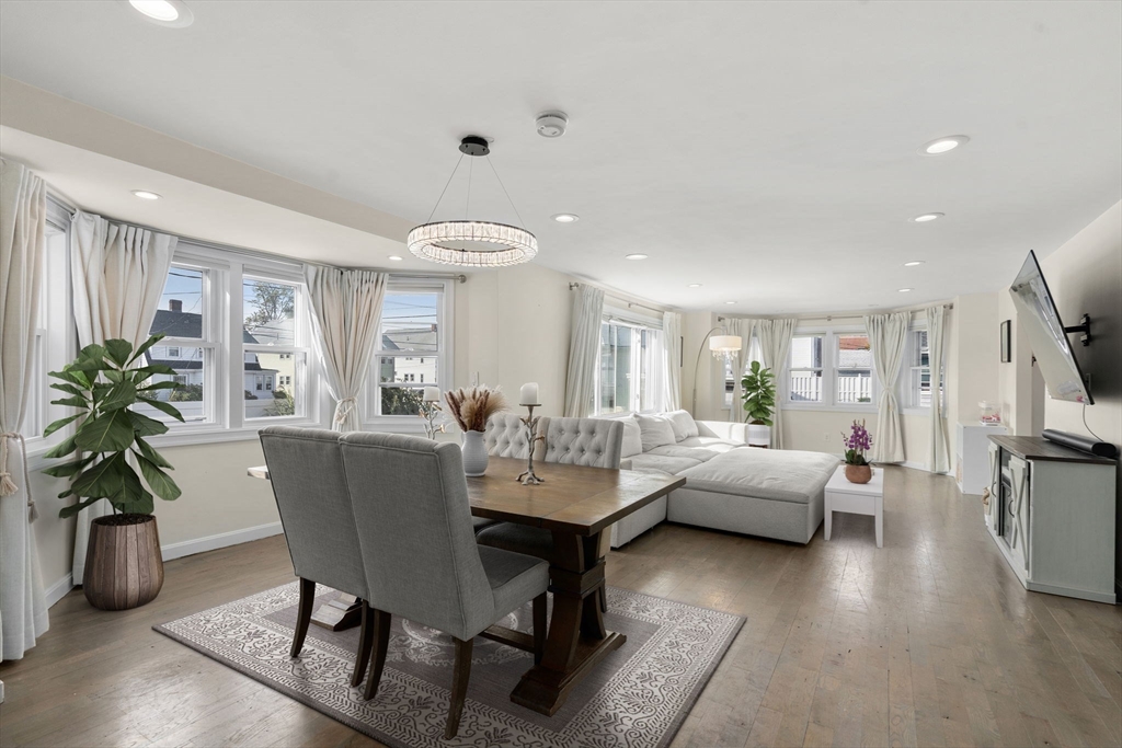 9 Marshall Street Winthrop, MA 02152 - Photo 2 of 34 a living room with fireplace furniture and a large window