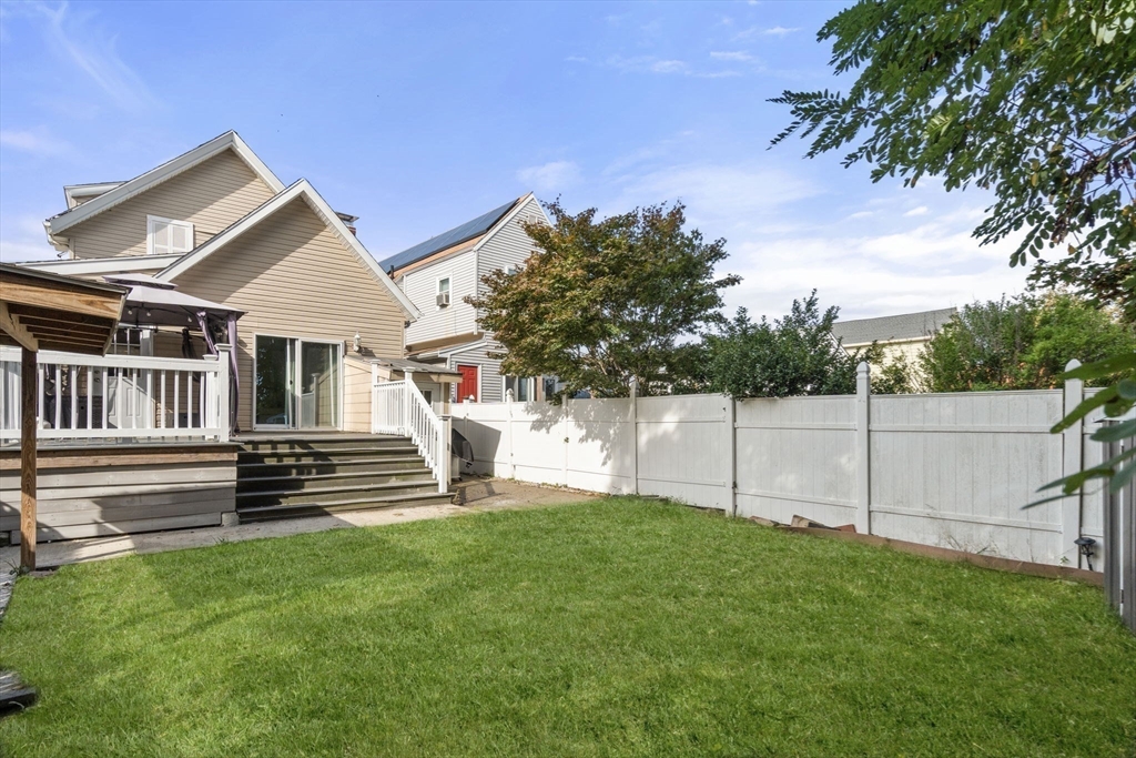 9 Marshall Street Winthrop, MA 02152 - Photo 27 of 34 a view of a house with a yard and wooden fence