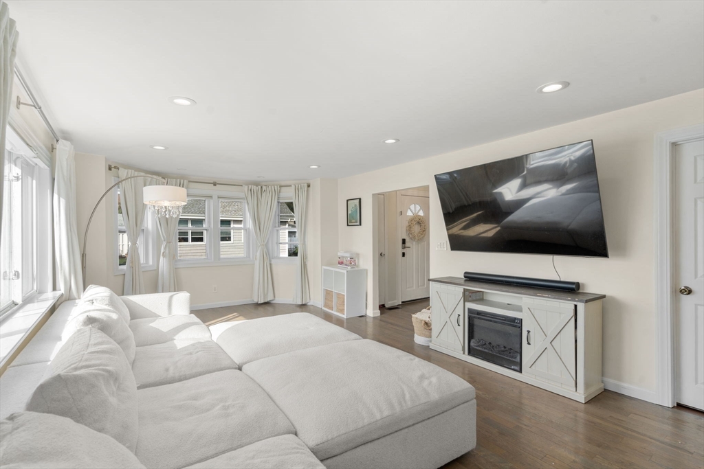 9 Marshall Street Winthrop, MA 02152 - Photo 3 of 34 a living room with furniture fireplace and flat screen tv