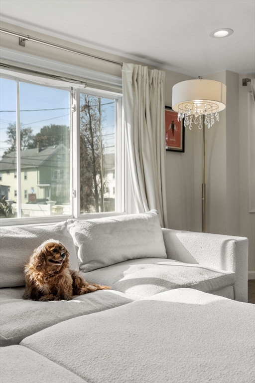 9 Marshall Street Winthrop, MA 02152 - Photo 4 of 34 a bedroom with a bed and a large window