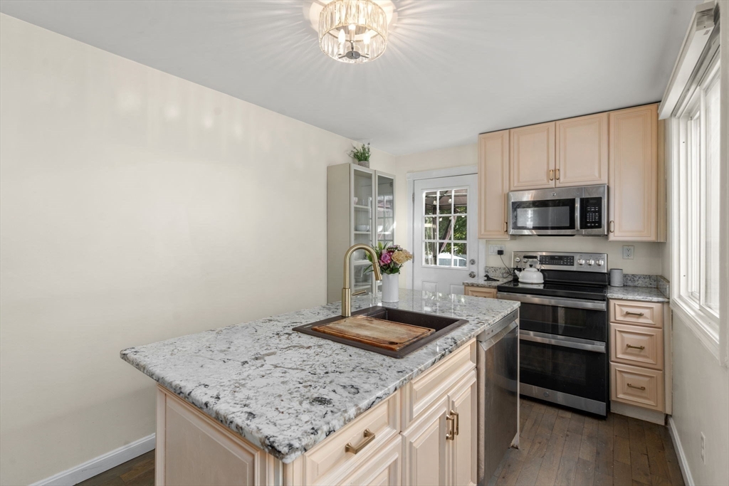 9 Marshall Street Winthrop, MA 02152 - Photo 8 of 34 a kitchen with a sink stove and microwave