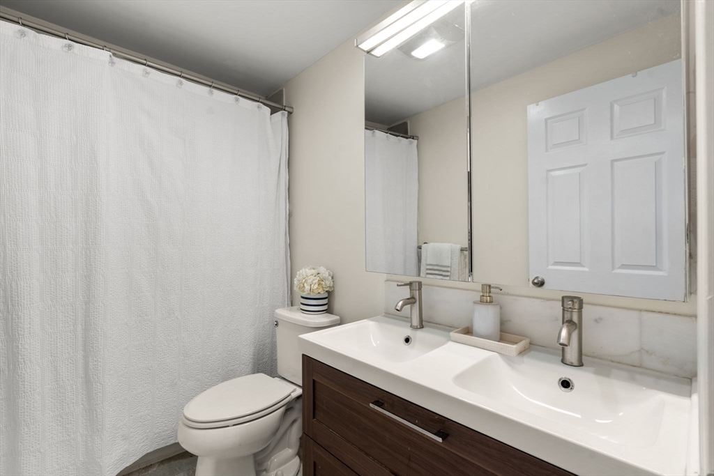 9 Marshall Street Winthrop, MA 02152 - Photo 10 of 34 a bathroom with a sink and a mirror