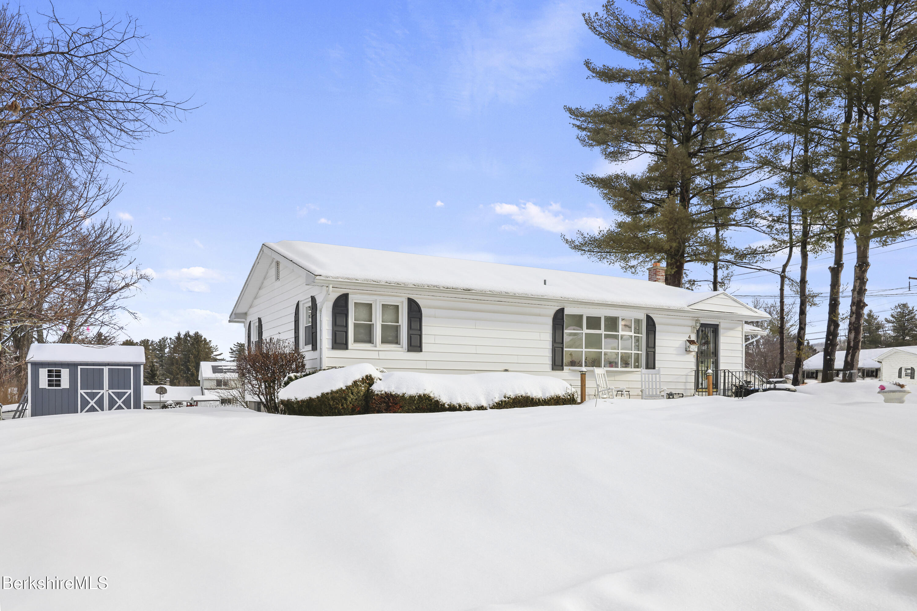 4 Paula Avenue Pittsfield, MA 01201 - Photo 4 of 36 a front view of a house with a yard covered in snow