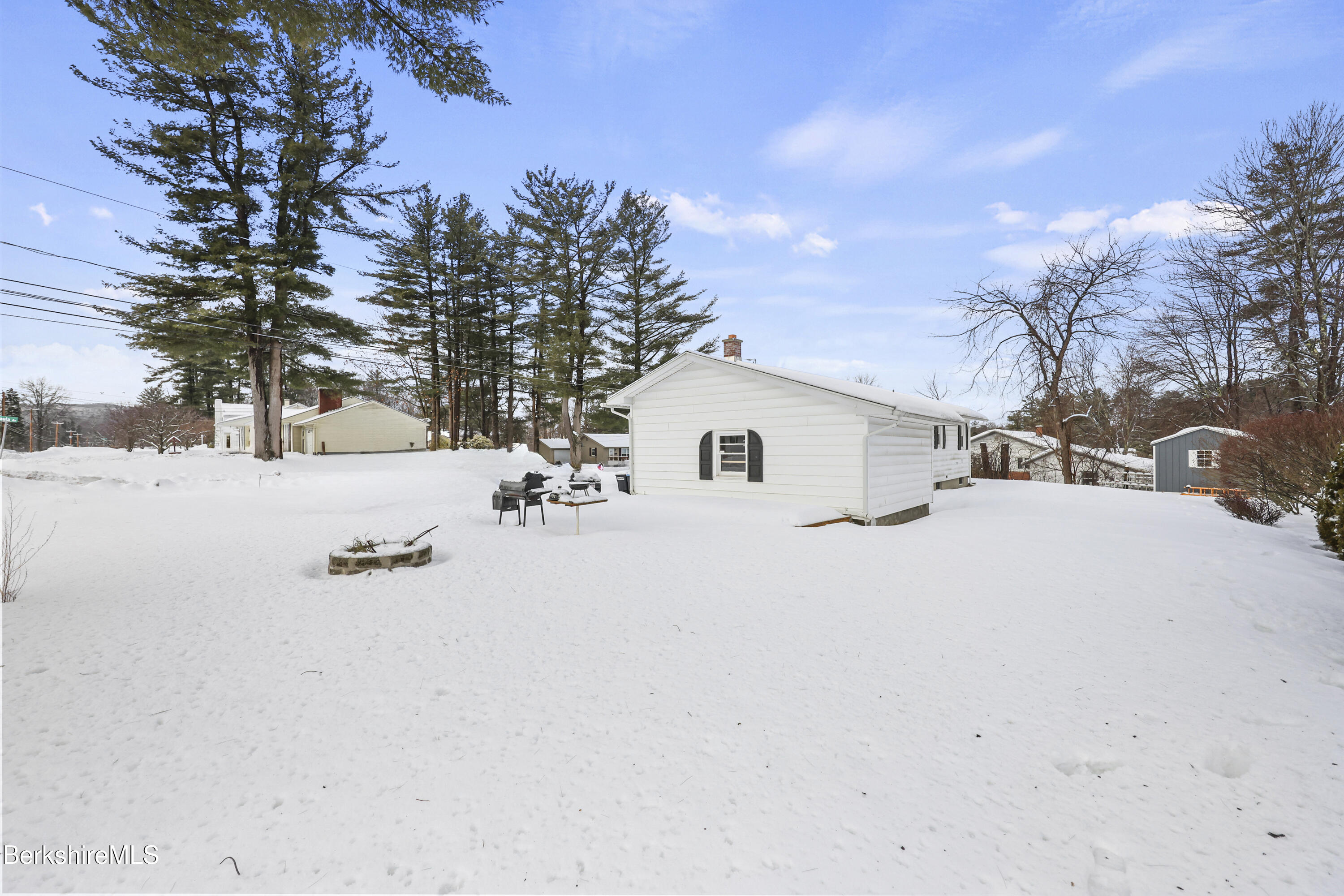 4 Paula Avenue Pittsfield, MA 01201 - Photo 8 of 36 a view of white house with snow on the road