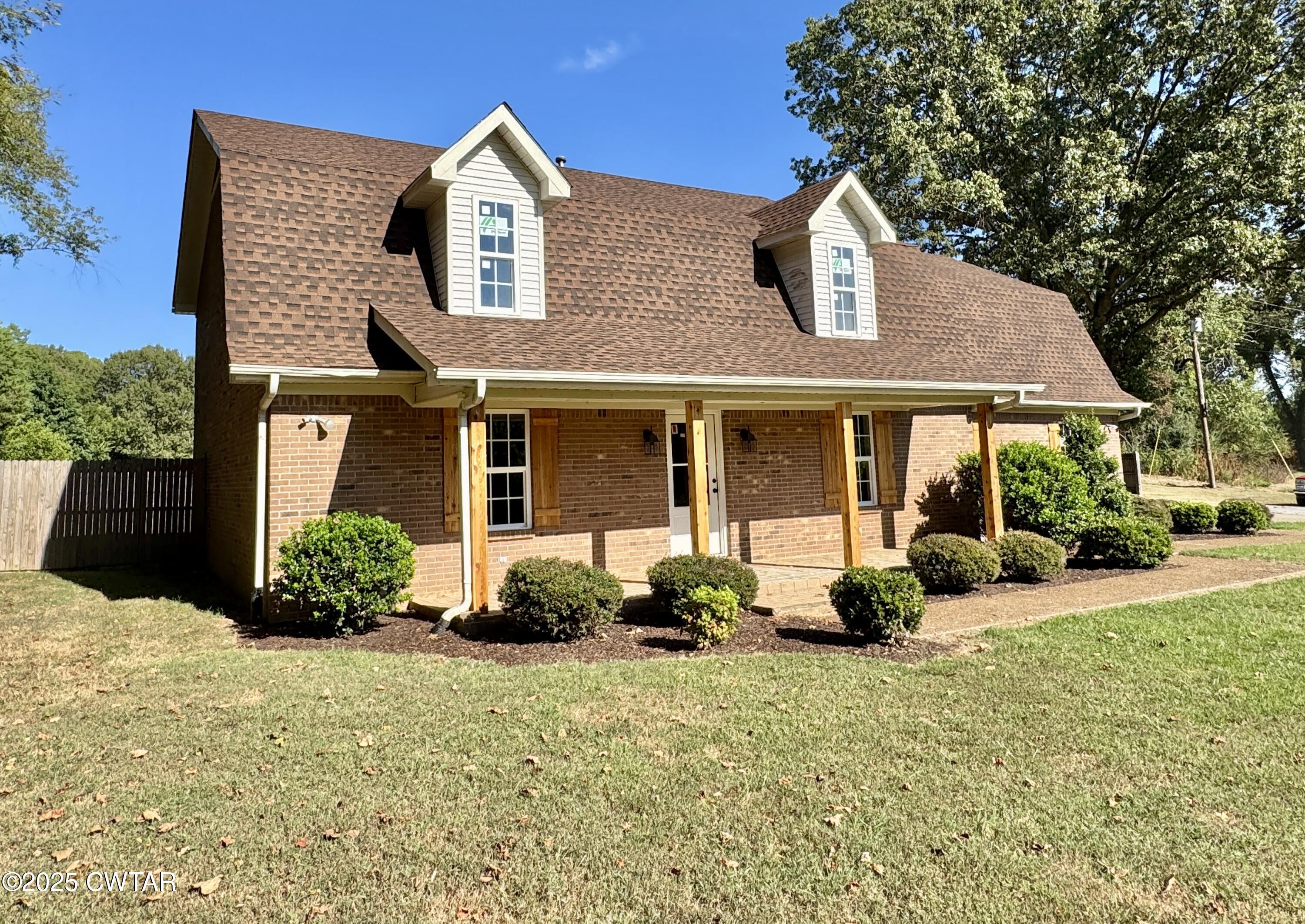 5720 Conner Whitefield Road Ripley, TN 38063 - Photo 18 of 18 a front view of a house with a yard