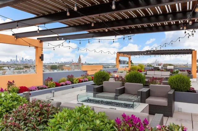 a outdoor living space with patio furniture and a potted plant
