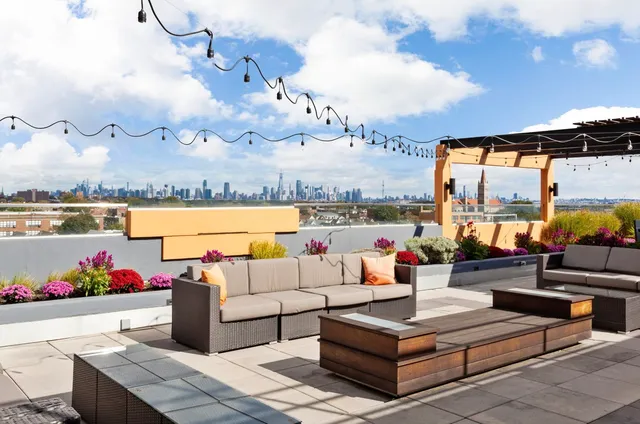 a outdoor living space with furniture and city view