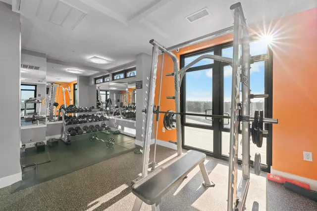 a kitchen with stainless steel appliances granite countertop a sink a stove and a refrigerator