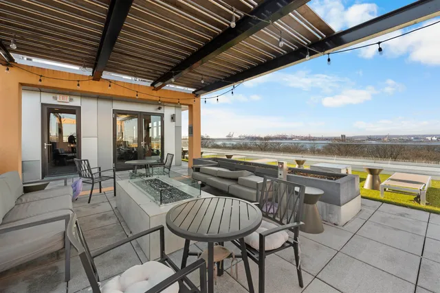 a view of roof deck with patio