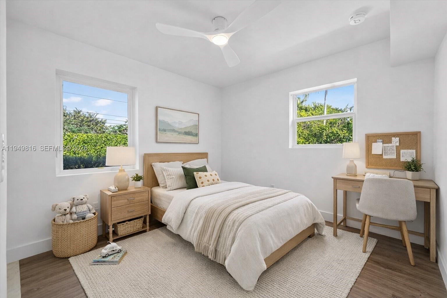 6735 Southwest 51st Street Miami, FL 33155 - Photo 11 of 34 a bedroom with a bed and a window