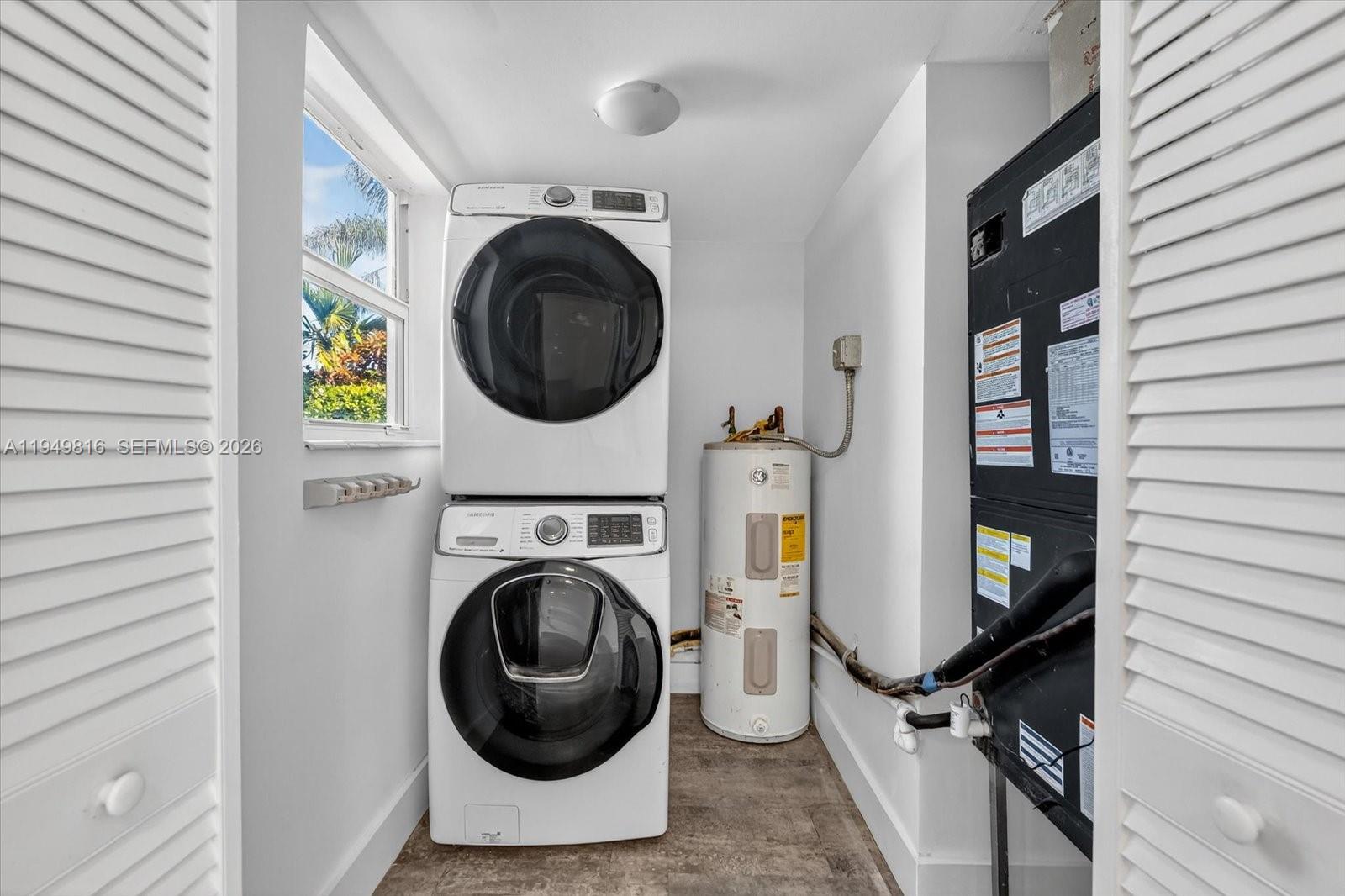 6735 Southwest 51st Street Miami, FL 33155 - Photo 22 of 34 a utility room with dryer and washer