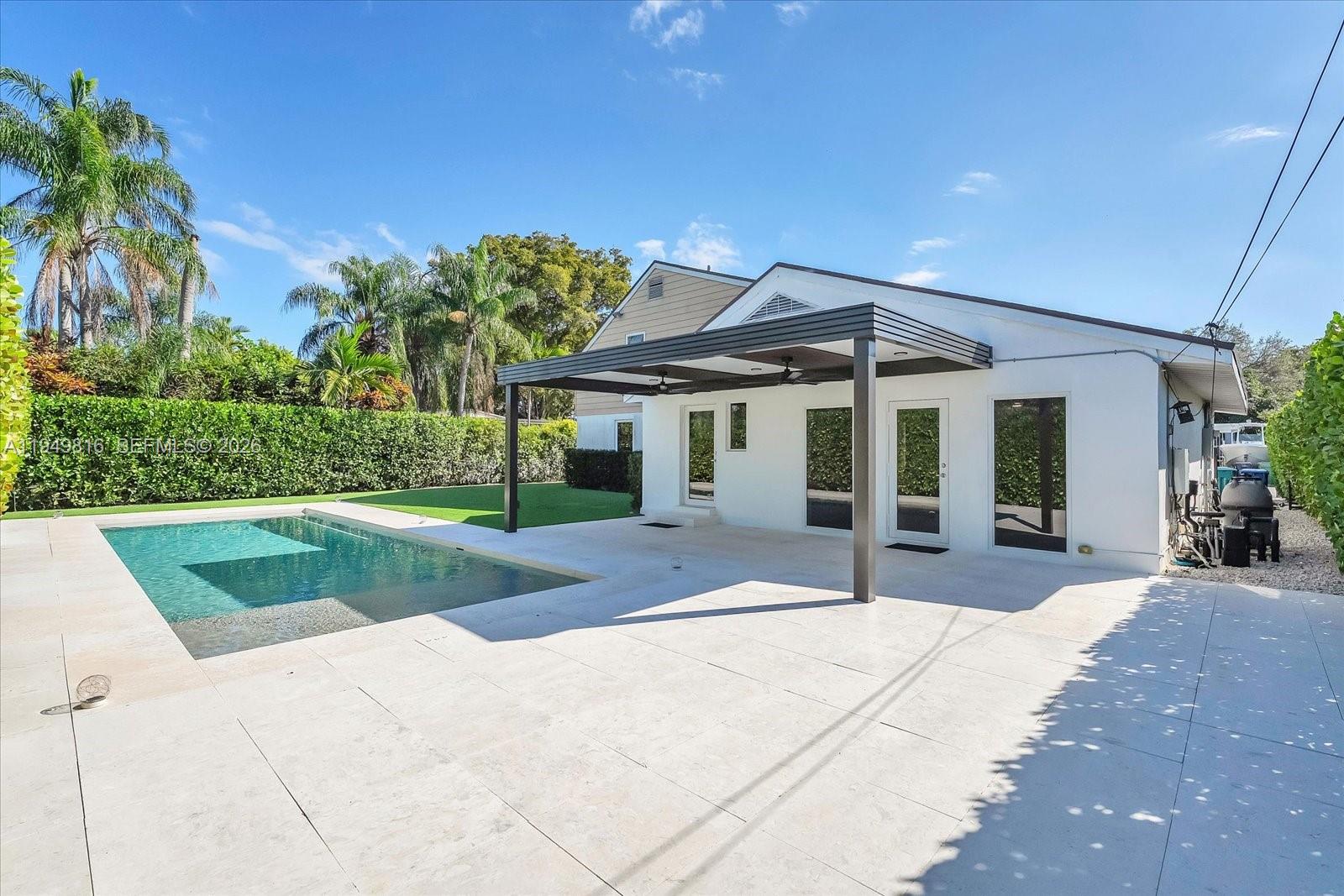 6735 Southwest 51st Street Miami, FL 33155 - Photo 24 of 34 a front view of a house with porch and garden
