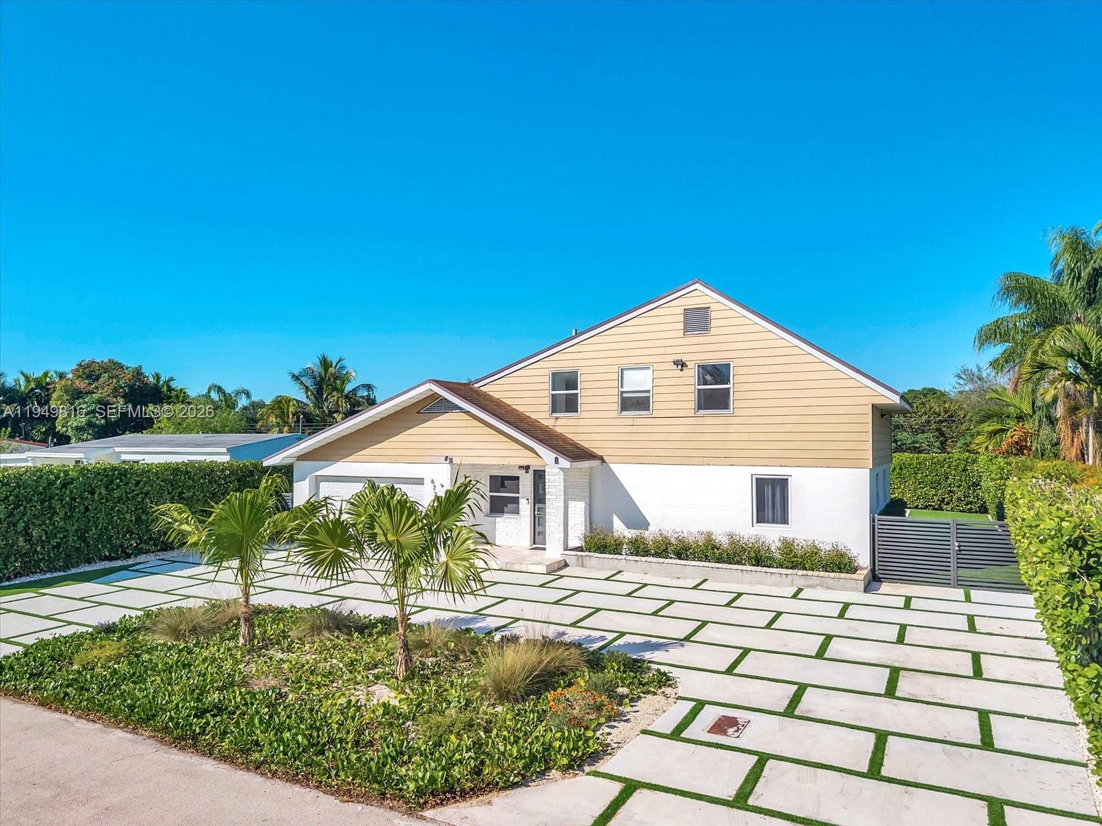 6735 Southwest 51st Street Miami, FL 33155 - Photo 27 of 34 a front view of a house with a yard