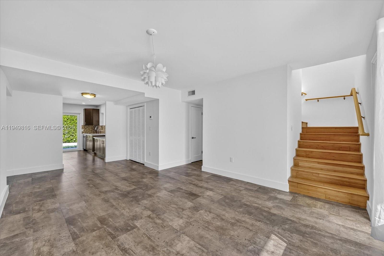 6735 Southwest 51st Street Miami, FL 33155 - Photo 5 of 34 a view of a livingroom with a staircase