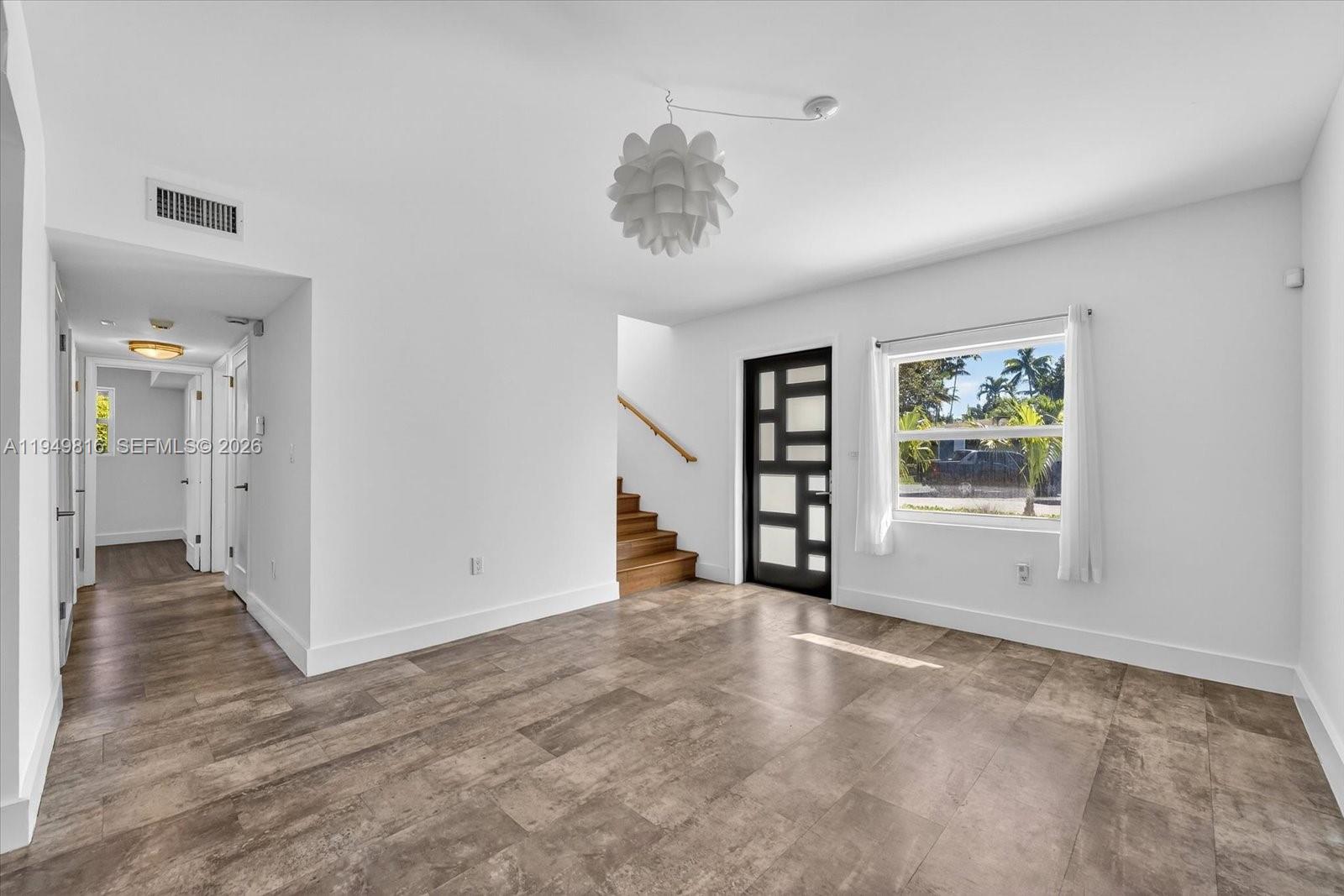 6735 Southwest 51st Street Miami, FL 33155 - Photo 7 of 34 an empty room with windows and closet