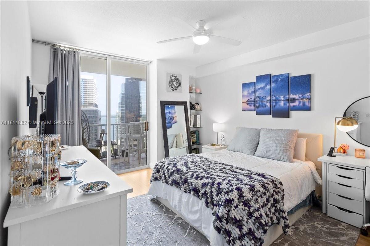 1250 South Miami Avenue, Unit 2208 Miami, FL 33130 - Photo 11 of 28 a bedroom with a bed and a large window