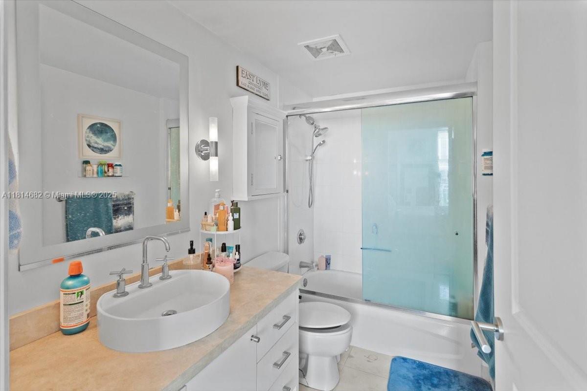1250 South Miami Avenue, Unit 2208 Miami, FL 33130 - Photo 13 of 28 a bathroom with a sink a toilet and shower