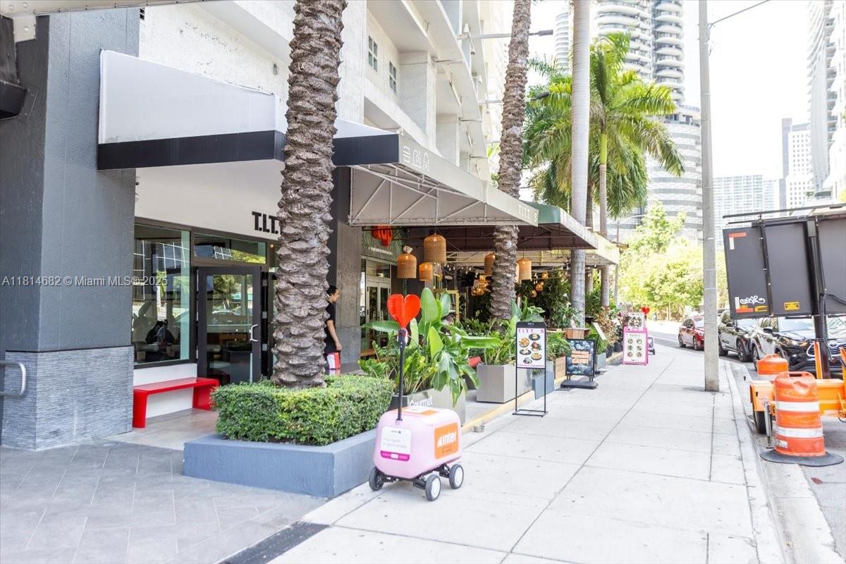 1250 South Miami Avenue, Unit 2208 Miami, FL 33130 - Photo 21 of 28 a building outdoor space with patio furniture and potted plants