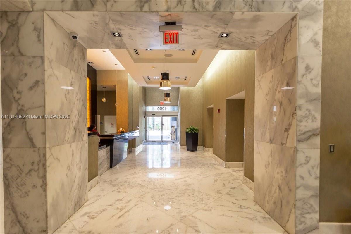 1250 South Miami Avenue, Unit 2208 Miami, FL 33130 - Photo 22 of 28 a view of a bathroom with a sink and shower