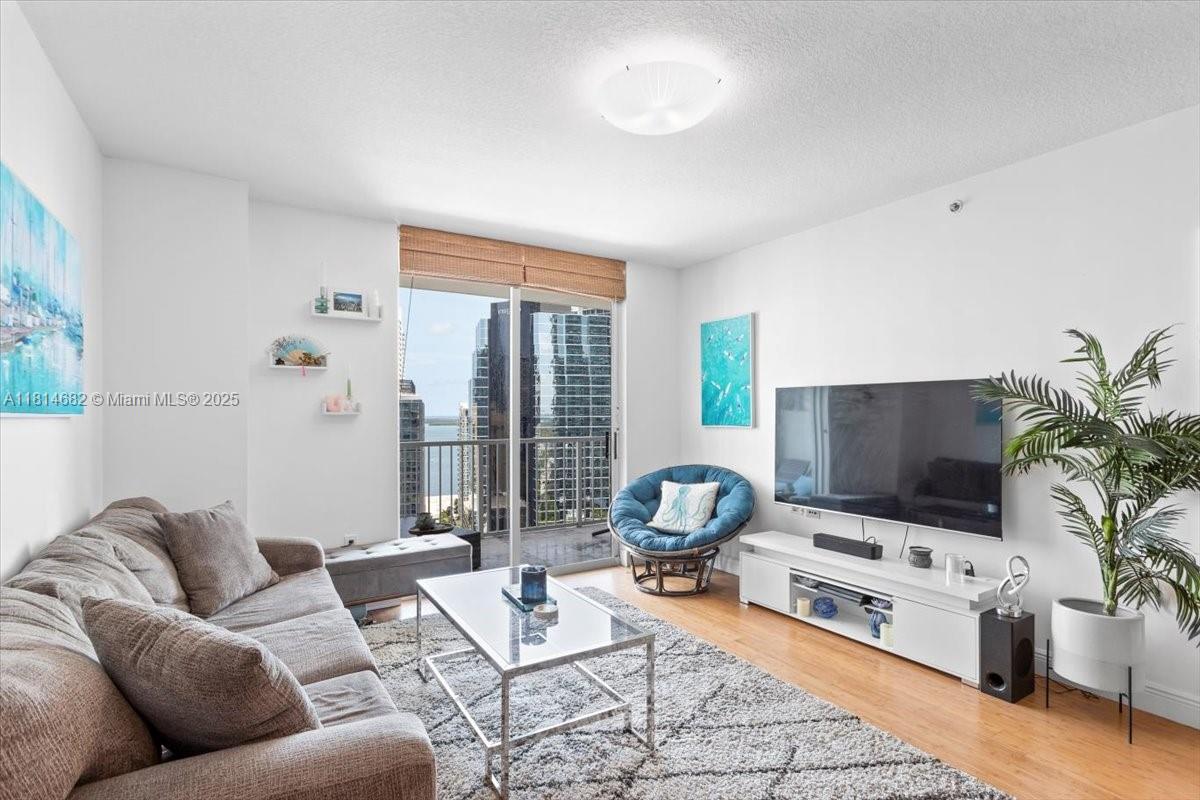 1250 South Miami Avenue, Unit 2208 Miami, FL 33130 - Photo 9 of 28 a living room with furniture and a flat screen tv