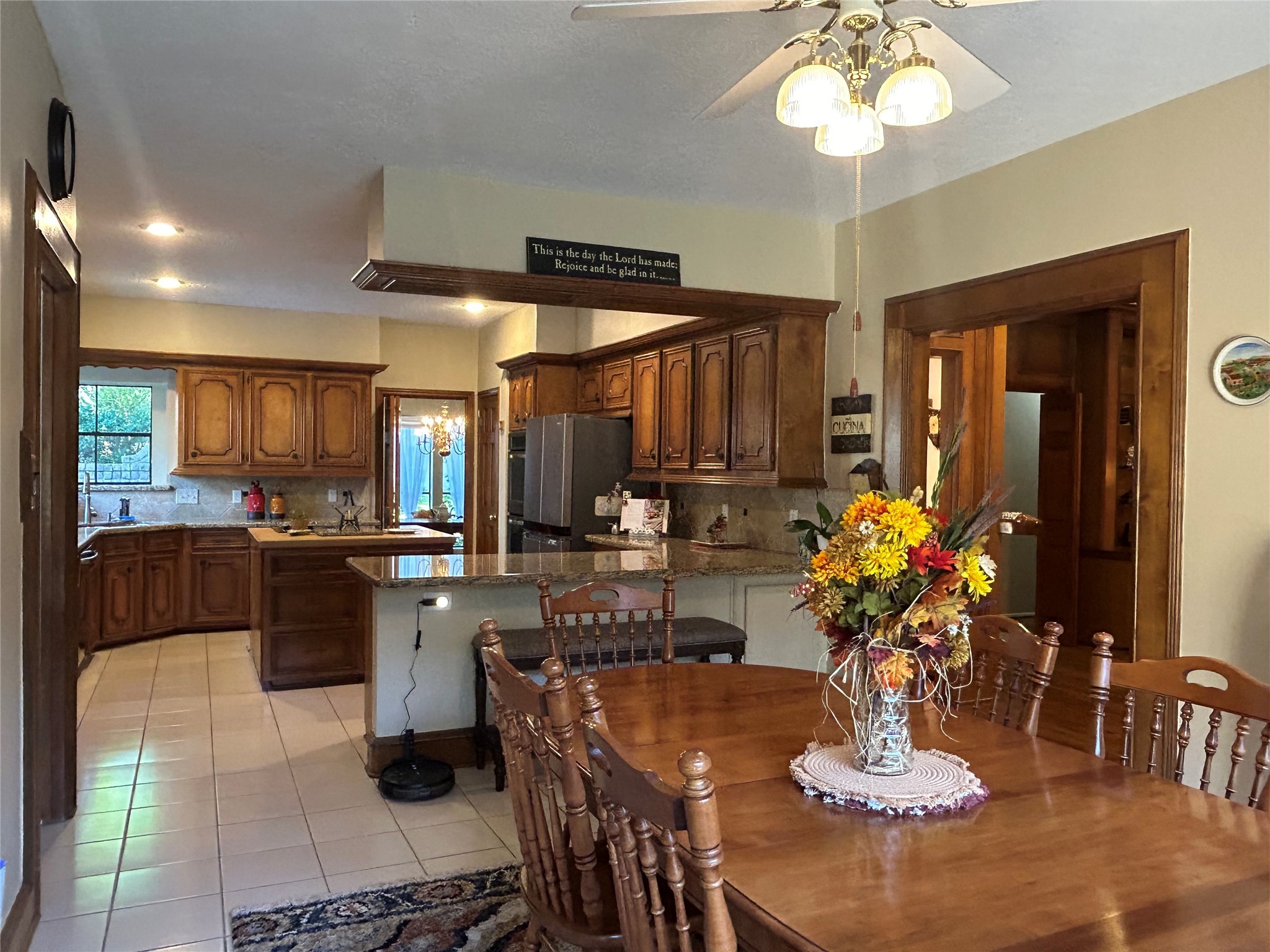 9547 Enstone Circle Spring, TX 77379 - Photo 16 of 45 a kitchen with a dining table and chairs