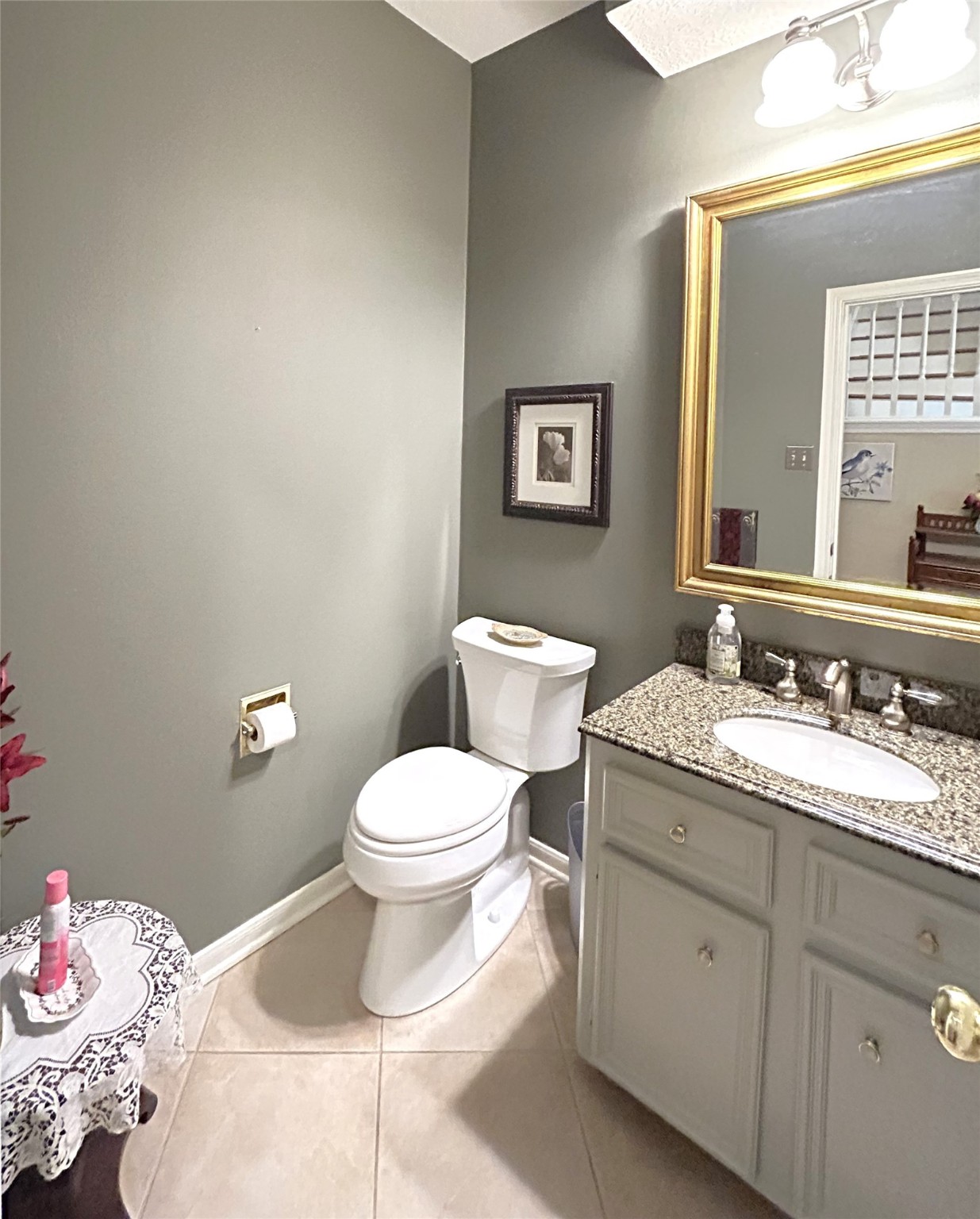 9547 Enstone Circle Spring, TX 77379 - Photo 18 of 45 a bathroom with a granite countertop toilet sink and mirror