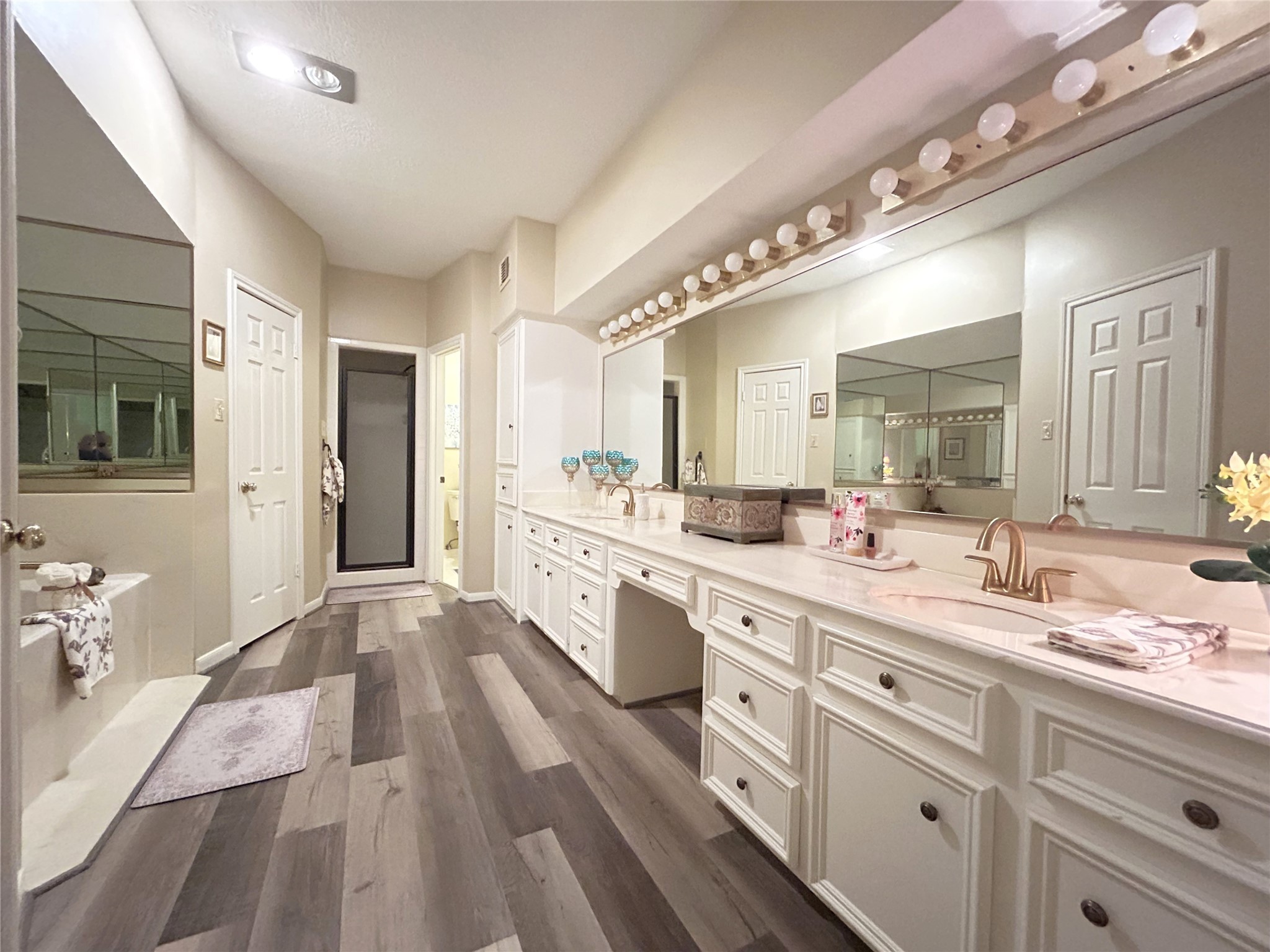 9547 Enstone Circle Spring, TX 77379 - Photo 22 of 45 a large bathroom with a sink mirror and a shower