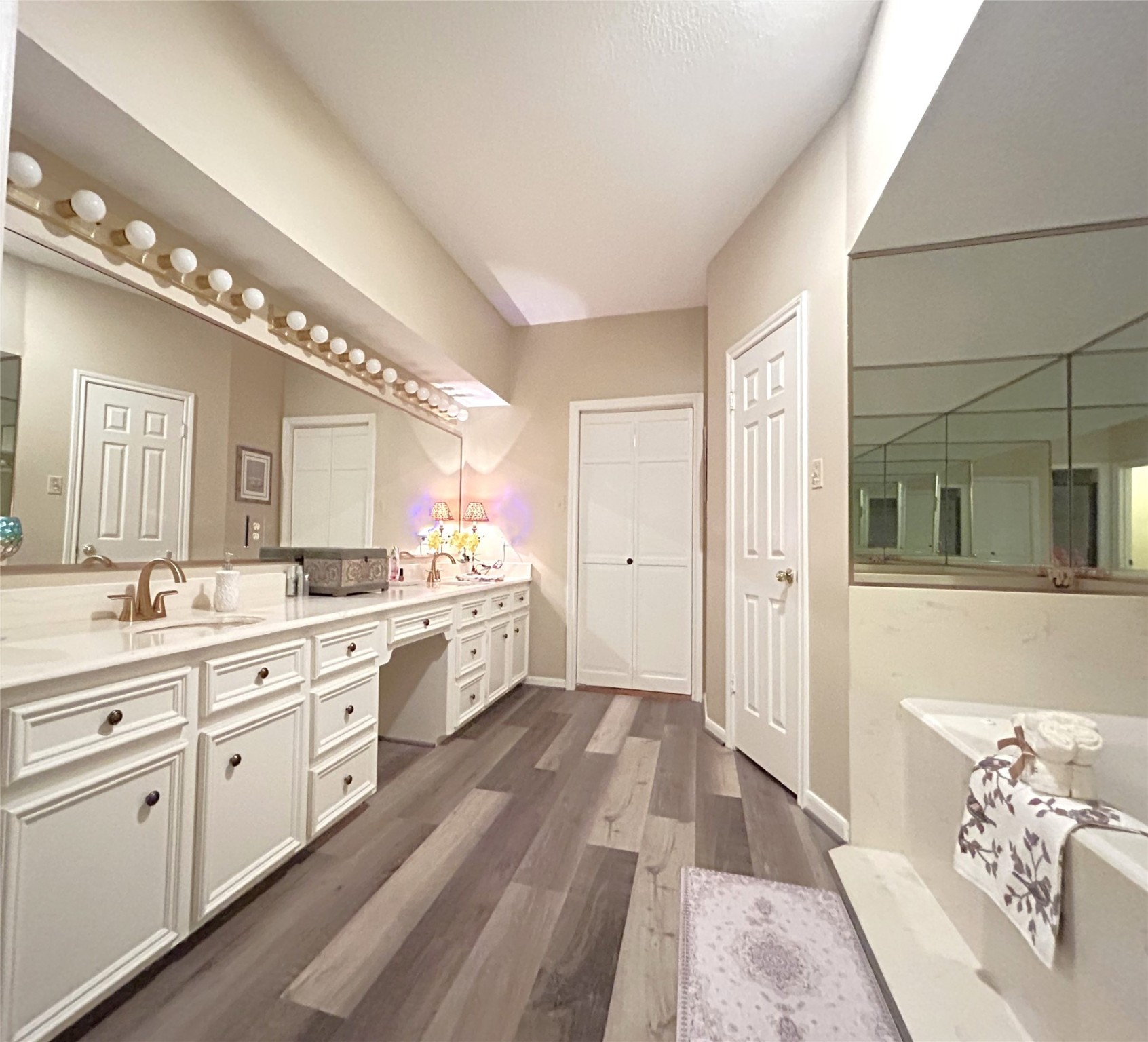 9547 Enstone Circle Spring, TX 77379 - Photo 23 of 45 a large bathroom with a double vanity sink and a mirror