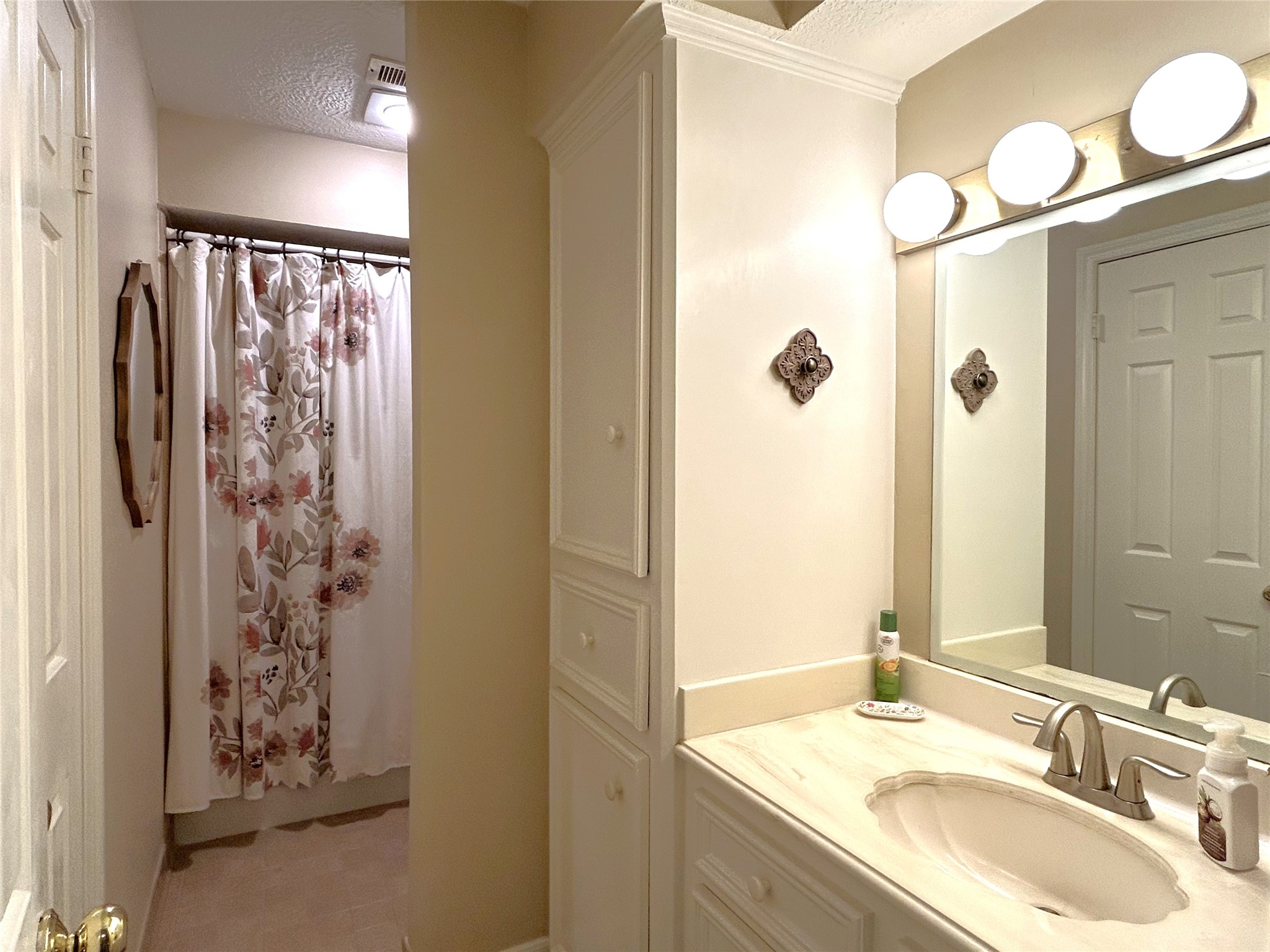 9547 Enstone Circle Spring, TX 77379 - Photo 30 of 45 a bathroom with a granite countertop shower sink and mirror