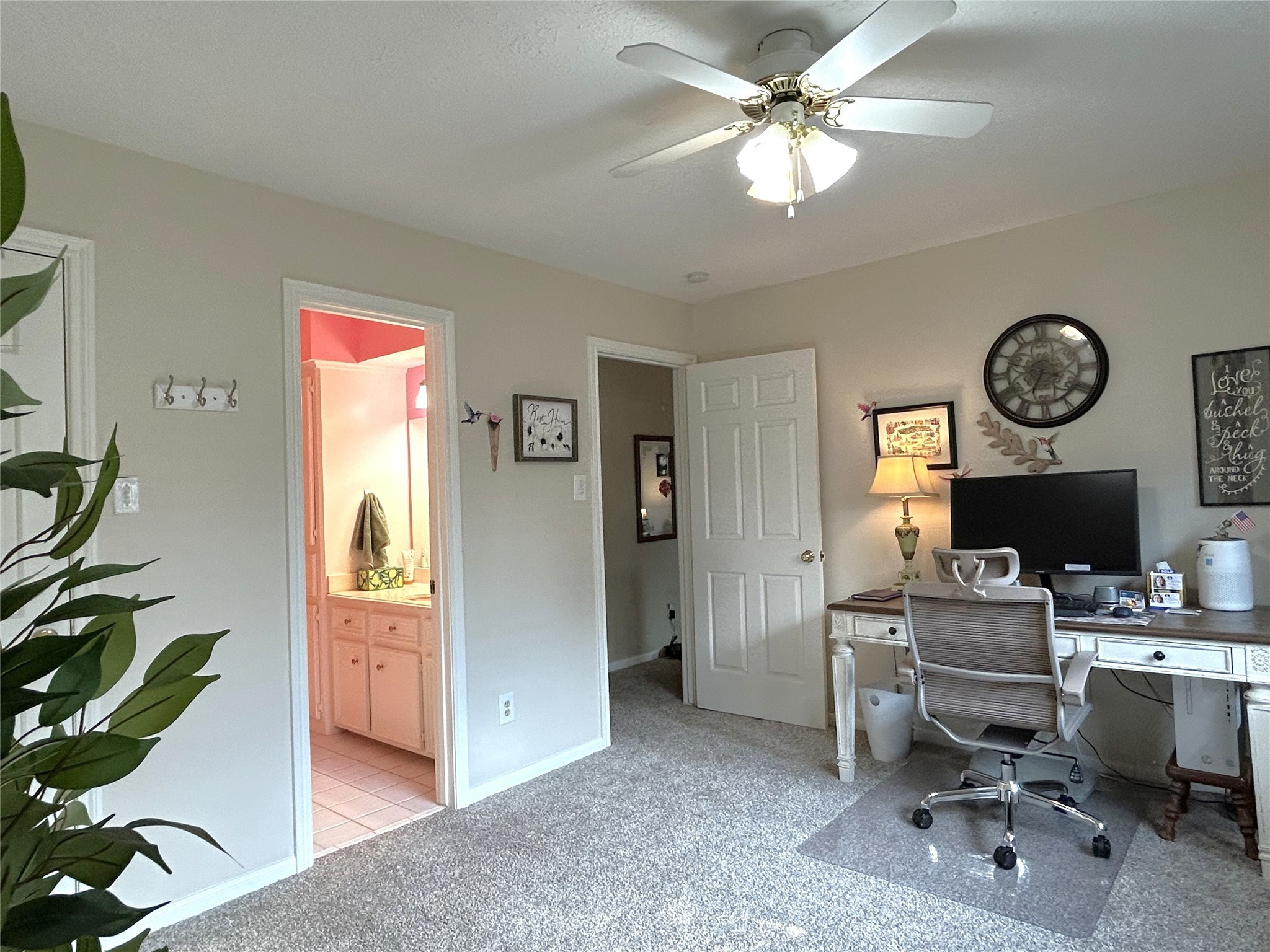 9547 Enstone Circle Spring, TX 77379 - Photo 36 of 45 a work room with furniture a clock and a window