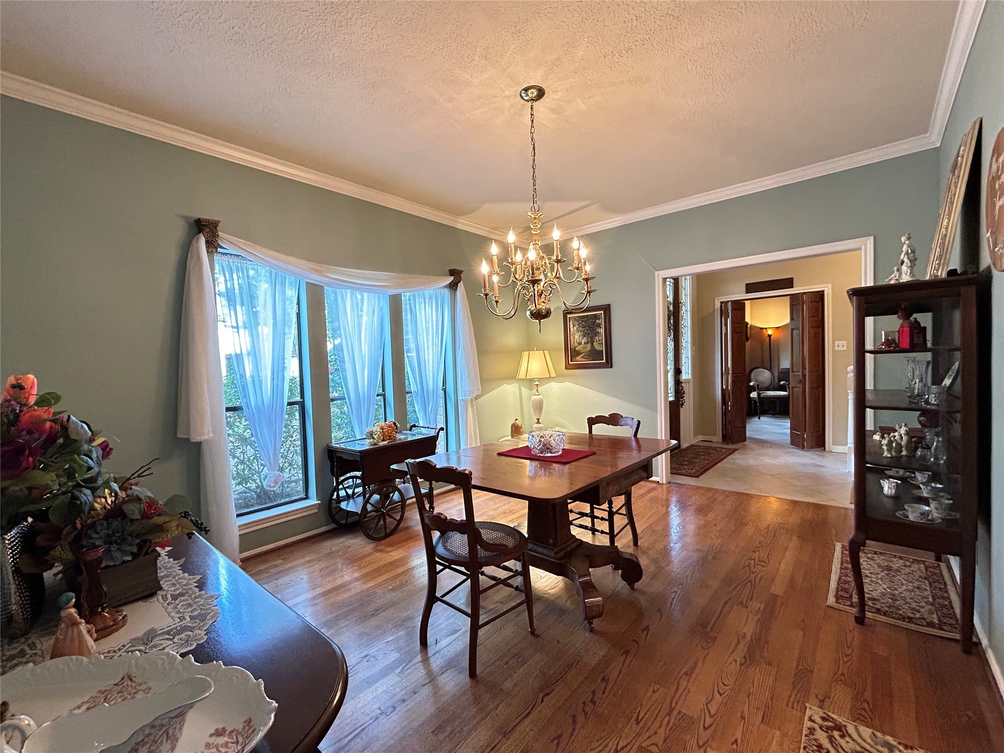 9547 Enstone Circle Spring, TX 77379 - Photo 9 of 45 a view of a dining room with furniture window and wooden floor