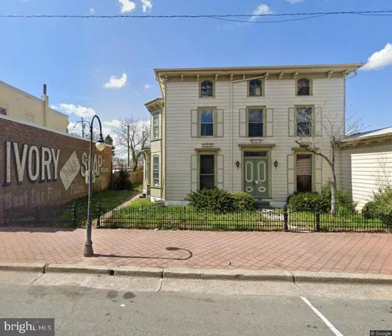 a front view of a building with garden