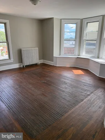 a bathroom with a sink toilet and a mirror
