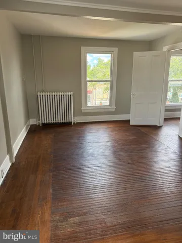 a bathroom with a double vanity sink mirror and toilet