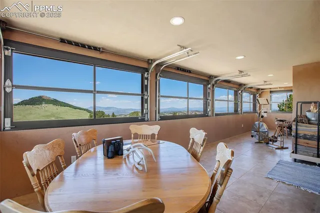 a living room with dining table